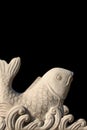 Carved stone fish