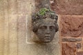 Carved stone head of a woman at the entrance of St Disens church in Bradninch, Devon Royalty Free Stock Photo