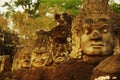 Carved stone heads at ancient temple in Angkor Wat Royalty Free Stock Photo