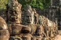 Carved stone heads near Bayon temple in Angkor Archaeological Park, Siem Reap, Cambodia