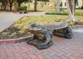 Carved stone `horned frog` bench on the campus of Texas Christian University.