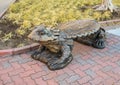 Carved stone `horned frog` bench on the campus of Texas Christian University.