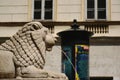 Stone lion sculpture and city foiuntain in Budapest. srucco facade background Royalty Free Stock Photo