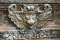 Carved stone wild boar head on a Hindu temple in Bali Indonesia Royalty Free Stock Photo