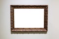 Carved wide dark brown picture frame on gray wall