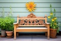carved wooden bench by flower garden Royalty Free Stock Photo