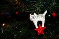 Carved Wooden Christmas Ornament of a White Kitty Cat on a Christmas Tree Royalty Free Stock Photo