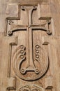 Carved wooden cross on a church door Royalty Free Stock Photo