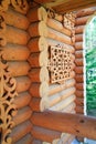 Carved wooden elements decorating a rural house. Handmade crafts