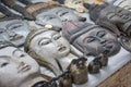 Carved wooden faces of Myanmar kings and ancient people