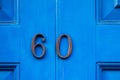 House number 60 with the sixty in metal Royalty Free Stock Photo