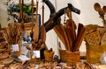 Carved wooden handicrafts, kitchen utensils on the counter of the craft fair.