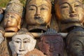Carved wooden heads of Buddha