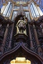 Carved wooden knight and organ in a cathedral Royalty Free Stock Photo