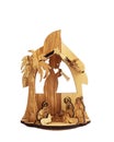 Carved wooden Nativity scene with Jesus isolated on white background. Royalty Free Stock Photo