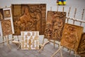 Carved wooden paintings outdoors.