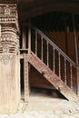 Carved wooden pillar and stairs in Nepal Royalty Free Stock Photo