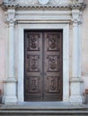 Carved wooden portal with scenes of saints from an ancient church Royalty Free Stock Photo