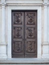 Carved wooden portal with scenes of saints from an ancient church Royalty Free Stock Photo