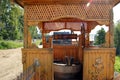 Carved wooden tower over the well at lake Igjboolat . detail, circumstance