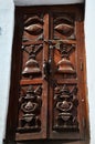 Carving art wooden eyes of wisdom buddha on antique wood door in ancient nepalese architecture and antique old ruin nepali royal