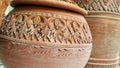Carving on clay water jar