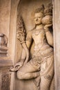 A carving of a doorkeeper