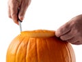 Carving a pumpkin for Halloween.