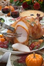 Carving Roasted Turkey on Harvest Table