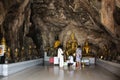 Carving stone and sculpture buddha image statue on cave wall for thai people travel visit respect praying blessing mystical at