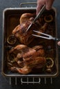 Carving a whole chicken with poultry shears