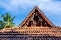 Carving wood gable roof on a resort hotel in India, Alappuzha, Kerala. Wooden roof structure, traditional indian style