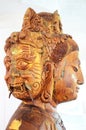 Carving Wooden Bodhisattva Goddess Statue or Guan Yin three face Royalty Free Stock Photo