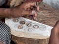 Carving a wooden printing block for textile block printing Royalty Free Stock Photo