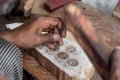 Carving a wooden printing block for textile block printing