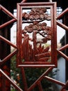 Carving on wooden window of Chinese garden building