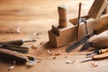 Carving and woodworking tools on wooden workbench in carpentry workshop. Wood processing and joinery work Royalty Free Stock Photo