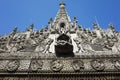 Carvings of Buddhist myths on ancient teak Shwenandaw monastery Golden palace in traditional Burmese architectural style