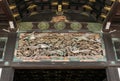 Carvings of exotic birds and floras beneath the entrance roof of Nijo Castle in Kyoto.