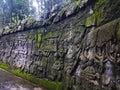 Carvings of stories from Balinese mythology on the walls near the entrance in Monkey Forest, Ubud, Bali, Indonesia