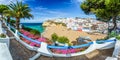 Carvoeiro town with colorful houses and yellow sand beach Royalty Free Stock Photo