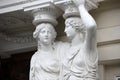 Caryatid. Statues of two young women in Vienna Royalty Free Stock Photo