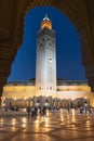 CASABLANCA, MOROCCO- JUNE, 8, 2019: dusk view of the minaret of hassan ii mosque framed by an arch in casablanca Royalty Free Stock Photo
