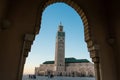 View of Hassan II mosque framed by the arch of a big gate