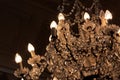 Cascade of crystals in antique chandelier, darkened room