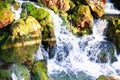 Cascade falls over mossy rocks Royalty Free Stock Photo