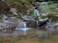 Small cascade with gentle flow into shallow waters