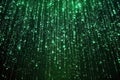 A cascade of green binary code creates a visual effect reminiscent of digital rain. This Royalty Free Stock Photo