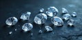 A cascade of loose, ethically sourced diamonds of various sizes sparkling under a spotlight on a dark slate. Royalty Free Stock Photo