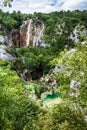 Cascades waterfalls falling from the rocks in the woods. Plitvice, National Park, Croatia